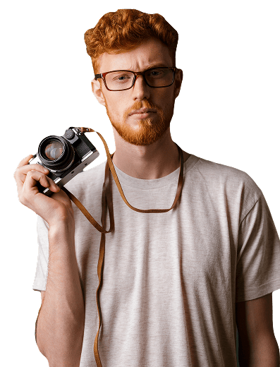 Photographer holding a camera in studio